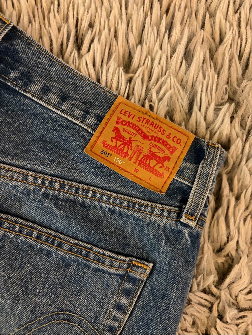 Levi's Women's Straight Leg Jeans in Blue with Tan Patch